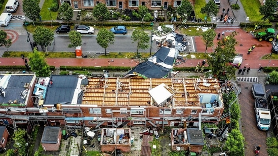 An aerial view shows the damage to the roof of adjacent buildings after a tornado ripped through the southwestern seaside city of Zierikzee.(AFP) An aerial view shows the damage to the roof of adjacent buildings after a tornado ripped through the southwestern seaside city of Zierikzee.(AFP)