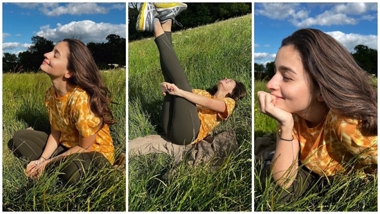 Alia Bhatt flaunted her bright smile for this garden photoshoot, dressed in a printed half-sleeve top and olive green skin-tight pants. She gave us the ultimate summer look in the ensemble and chose chunky sneakers and soft glam to round off the styling.(Instagram)
