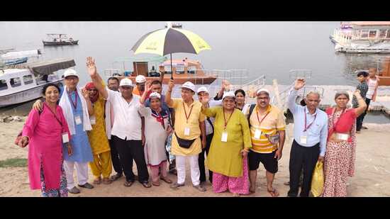 Passengers of the inaugural Bharat Gaurav train at Sangam in Prayagraj on Monday. (HT PHOTO)