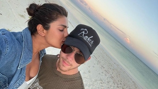 On Monday, Priyanka shared her holiday pictures from the Turks and Caicos Islands with her 79.9 million-strong Instagram family. The star captioned her post with hashtags #islandgirl and #photodump. The first picture showed Priyanka kissing Nick on the cheeks, followed by the couple chilling on a yacht, the Matrix actor running on the beach, taking a nap, swimming in the sea, sipping coconut water and enjoying the beach.(Instagram)