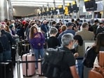 Passengers queue inside the departures terminal of Terminal 2 at Heathrow Airport in London, Britain (REUTERS/Henry Nicholls)