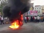 Locals stage a protest over the murder. (ANI Twitter)