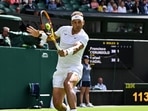Spain's Rafael Nadal returns the ball to Argentina's Francisco Cerundolo during their men's singles tennis match on the second day of the 2022 Wimbledon Championships. Spain's Rafael Nadal returns the ball to Argentina's Francisco Cerundolo during their men's singles tennis match on the second day of the 2022 Wimbledon Championships.