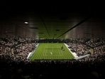 Spectators attend a Wimbledon match.