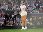Wimbledon - Britain's Emma Raducanu celebrates winning her first round match against Belgium's Alison Van Uytvanck