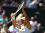 Poland's Iga Swiatek celebrates winning her first round match against Croatia's Jana Fett