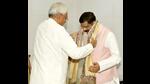 Bihar chief minister Nitish Kumar honours union minister Dharmendra Pradhan at his official residence in Patna on Tuesday. (Santosh Kumar/HT Photo) Bihar chief minister Nitish Kumar honours union minister Dharmendra Pradhan at his official residence in Patna on Tuesday. (Santosh Kumar/HT Photo)