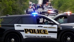 Police block the scene where a semitrailer with multiple dead bodies was discovered, Monday, June 27, 2022, in San Antonio.