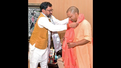BJP leader Dinesh Lal Yadav meets Chief Minister Yogi Adityanath after his victory in Azamgarh Lok Sabha by-election, in Lucknow on Tuesday. (ANI) BJP leader Dinesh Lal Yadav meets Chief Minister Yogi Adityanath after his victory in Azamgarh Lok Sabha by-election, in Lucknow on Tuesday. (ANI)