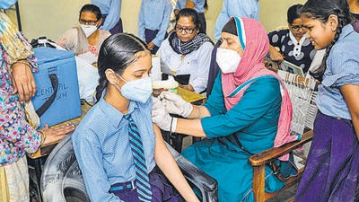 Jalandhar: A health worker administers a dose of COVID-19 vaccine to a student, amid rise in coronavirus cases, at a government school, in Jalandhar, Monday, May 2, 2022. (PTI Photo) (PTI05_02_2022_000108B) (PTI) Jalandhar: A health worker administers a dose of COVID-19 vaccine to a student, amid rise in coronavirus cases, at a government school, in Jalandhar, Monday, May 2, 2022. (PTI Photo) (PTI05_02_2022_000108B) (PTI)