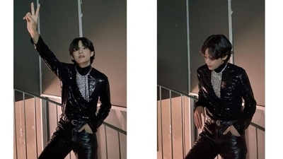 V accessorised his uber-chic outfit with an OTT silver necklace adorned with shimmering diamantes, a leather belt, and black heeled boots. The Christmas Tree singer's signature centre-parted messy hairdo, dewy skin, and soft glam look gave the finishing touches to his attire for the Paris Fashion Week. (Instagram/@thv) V accessorised his uber-chic outfit with an OTT silver necklace adorned with shimmering diamantes, a leather belt, and black heeled boots. The Christmas Tree singer's signature centre-parted messy hairdo, dewy skin, and soft glam look gave the finishing touches to his attire for the Paris Fashion Week. (Instagram/@thv)