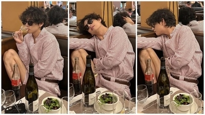 Another set of photos shows V enjoying a lunch date in Paris. The star wore a pink and white striped coordinated ensemble. It features a Mandarin-collared shirt with long sleeves and a button-up front. He tucked it inside matching shorts and styled the outfit with sunglasses and a leather belt. (Instagram/@thv) Another set of photos shows V enjoying a lunch date in Paris. The star wore a pink and white striped coordinated ensemble. It features a Mandarin-collared shirt with long sleeves and a button-up front. He tucked it inside matching shorts and styled the outfit with sunglasses and a leather belt. (Instagram/@thv)
