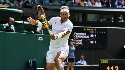 Spain's Rafael Nadal returns the ball to Argentina's Francisco Cerundolo during their men's singles tennis match on the second day of the 2022 Wimbledon Championships. (AFP) Spain's Rafael Nadal returns the ball to Argentina's Francisco Cerundolo during their men's singles tennis match on the second day of the 2022 Wimbledon Championships. (AFP)