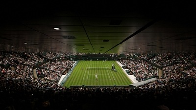 Spectators attend a Wimbledon match. (REUTERS)