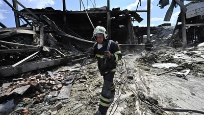 Rescuers clear rubbles of the Amstor mall in Kremenchuk. (AFP) Rescuers clear rubbles of the Amstor mall in Kremenchuk. (AFP)