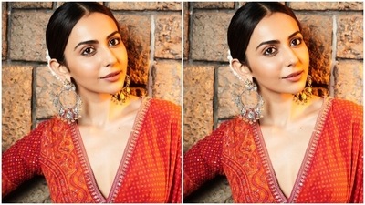 On Monday, Rakul shared pictures from a photoshoot with the caption, "Reigning my love for a timeless classic." The Runway 34 actor wore a red Bandhani saree and an embellished blouse for the clicks. Minimal jewellery and glam picks added the finishing touch. (Instagram) On Monday, Rakul shared pictures from a photoshoot with the caption, "Reigning my love for a timeless classic." The Runway 34 actor wore a red Bandhani saree and an embellished blouse for the clicks. Minimal jewellery and glam picks added the finishing touch. (Instagram)