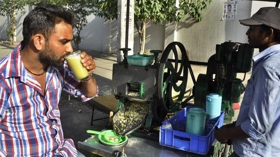 5. Sugarcane Juice - Sugarcane juice is the ideal drink to cool off in the summer. It can also be used as a source of energy. Another key health benefit of sugarcane juice, which is alternatively available as sugarcane sachet, is that it is high in good carbs, protein, iron, potassium, and other essential elements, making it an excellent energy drink. A glass of chilled sugarcane juice, especially in the summer, might help replenish your body's depleted energy levels. It helps to replenish plasma and bodily fluids, as well as combat dryness and weariness. It's high in antioxidants, acts as a diuretic, and aids with liver health. As it is rich in antioxidants, it acts as a diuretic and helps keep your liver strong. "It is high in carbohydrates, proteins, and minerals, which our bodies require. It is high in antioxidants and so beneficial for dehydration. It has a surprising number of health benefits," said Suresh Reddy D, Co-Founder and COO of Foodio.fit. He highlighted that sachet for sugarcane are convenient to carry and consume. He also listed some benefits of sugarcane sachet that include: a) Immunity booster: Sugarcane juice is a great source of quick energy and an immunity booster. It is high in antioxidants, which support our immune system. It is known to help prevent infections in the stomach, liver, and lungs. It fights a variety of disorders, including cancer. It can assist you by increasing your energy levels. b) Rich in antioxidants: Sugarcane juice is known for its antioxidant property, which aids in the removal of harmful poisons and other undesirable substances from our bodies. It aids in improving the body's metabolism. c) Helps in proper digestion: Sugarcane juice is a digestive tonic that aids in regular digestion. It is extremely beneficial in the treatment of constipation. It also aids in the maintenance of our body's acid-base balance. (Sikander Singh Chopra/HT)