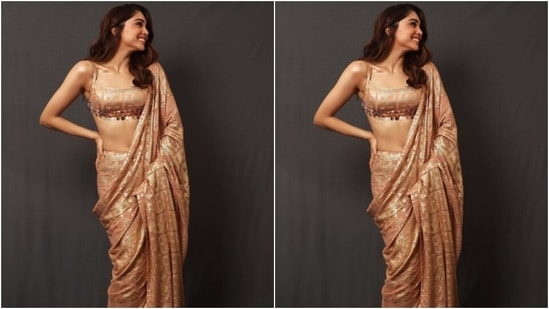 Sharvari teamed a pastel pink saree that came intricately detailed in golden moti. She teamed it with a blouse of the same print that featured slip in golden straps at the shoulders.(Instagram/@sharvari)