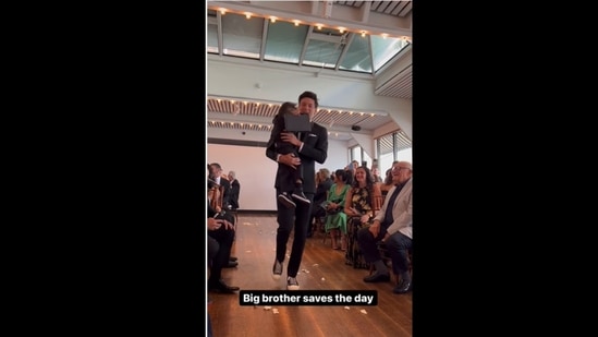 The kid who was ringbearer got nervous to walk down the aisle so his big brother carried him. (almosttripletsnyc/Instagram) The kid who was ringbearer got nervous to walk down the aisle so his big brother carried him. (almosttripletsnyc/Instagram)