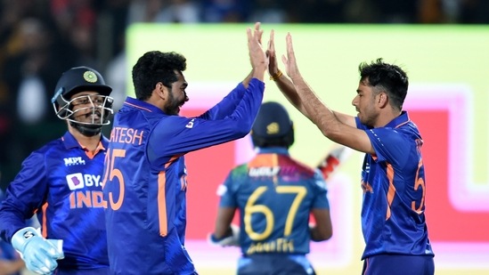 Indian bowler Ravi Bishnoi (R) celebrates with teammate Venkatesh Iyer(PTI)