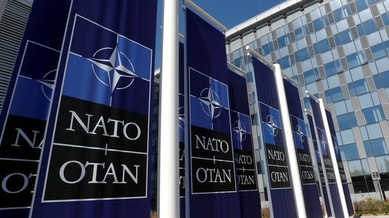 Banners displaying the NATO logo are placed at the entrance of new NATO headquarters during the move to the new building, in Brussels, Belgium.(REUTERS)