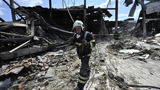 Rescuers clear rubbles of the Amstor mall in Kremenchuk.(AFP) Rescuers clear rubbles of the Amstor mall in Kremenchuk.(AFP)