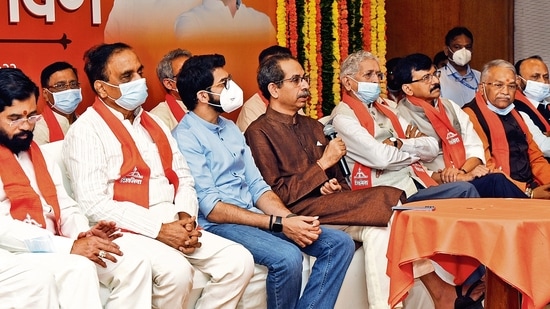 Eknath Shinde (left) with Shiv Sena leader Aaditya Thackeray and CM Uddhav Thackeray at an event to mark the party’s Foundation Day in Mumbai on June 19. (Hindustan Times). (File)&nbsp;