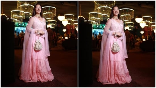 Disha's blush pink lehenga set comes with a short sleeveless choli decked with silver thread embroidery, gold sequinned embellishments, beaded adornments on the torso and borders, silver gota patti work, a plunging neckline, bodycon silhouette and a cropped hem hinting at the star's toned midriff.(Instagram)