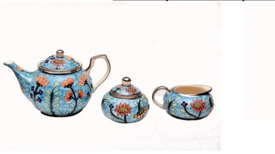 Prime Minister Narendra Modi gifted a platinum-painted, hand-painted tea set from Bulandhshahr, Uttar Pradesh to UK prime minister Boris Johnson. The crockery is outlined with platinum metal paint in honour of the Queen's platinum jubilee that is being celebrated this year. The embossed outlines are laid on manually with Mehndi cone work.(ANI)
