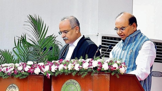 Lieutenant governor VK Saxena (right) on Tuesday administered the oath of office to justice Satish Chandra Sharma as the chief justice of Delhi high court in a ceremony at Raj Niwas. (HT Photo)