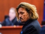 US actor Johnny Depp in court during the $50 million Depp vs Heard defamation trial last month. He has been spotted at Paris airport in a new look.(AFP) US actor Johnny Depp in court during the $50 million Depp vs Heard defamation trial last month. He has been spotted at Paris airport in a new look.(AFP)