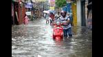 People wade through a waterlogged street in Patna on Wednesday. (Santosh Kumar/HT Photo) People wade through a waterlogged street in Patna on Wednesday. (Santosh Kumar/HT Photo)