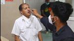 A health worker collects a swab sample of a man at MMG Hospital in Ghaziabad on Wednesday. (Sakib Ali/HT photo) A health worker collects a swab sample of a man at MMG Hospital in Ghaziabad on Wednesday. (Sakib Ali/HT photo)