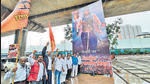 Thane Shiv Sena South Indian Cell members put up a banner in support of Eknath Shinde depicting him as Bahubali outside his house on Wednesday (Praful Gangurde) Thane Shiv Sena South Indian Cell members put up a banner in support of Eknath Shinde depicting him as Bahubali outside his house on Wednesday (Praful Gangurde)