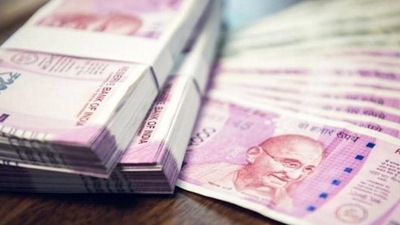 Indian Rupee money stacks and banknotes on the table , closed up shot (Shutterstock) Indian Rupee money stacks and banknotes on the table , closed up shot (Shutterstock)