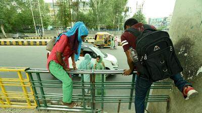 Noida, India- June 28, 2022: Pedestrians experience inconvenience while crossing the road due to the lack of a foot-over-bridge (FOB) at in Noida, India, on Tuesday, June 28, 2022. (Photo by Sunil Ghosh / Hindustan Times) (Hindustan Times) Noida, India- June 28, 2022: Pedestrians experience inconvenience while crossing the road due to the lack of a foot-over-bridge (FOB) at in Noida, India, on Tuesday, June 28, 2022. (Photo by Sunil Ghosh / Hindustan Times) (Hindustan Times)