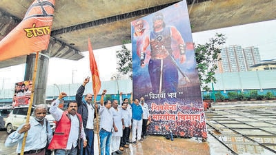 Thane Shiv Sena South Indian Cell members put up a banner in support of Eknath Shinde depicting him as Bahubali outside his house on Wednesday (Praful Gangurde) Thane Shiv Sena South Indian Cell members put up a banner in support of Eknath Shinde depicting him as Bahubali outside his house on Wednesday (Praful Gangurde)