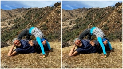 At 10000ft, Ankita practised Chakrasana, while Milind lied down and posed for the cameras. (Instagram/@milindrunning)