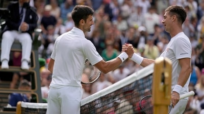 Serbia's Novak Djokovic shakes hands with Australia's Thanasi Kokkinakis&nbsp; (AP)