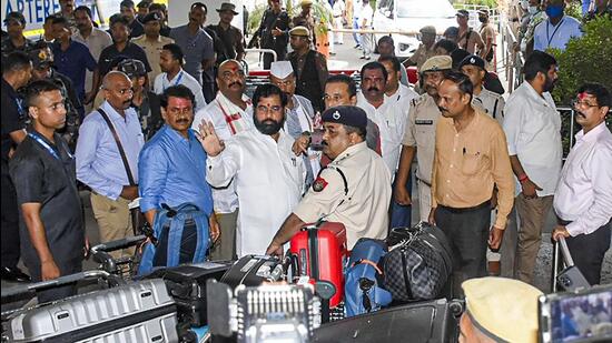 Rebel Shiv Sena leader Eknath Shinde with supporting MLAs arrives at Guwahati International Airport, Wednesday, June 29, 2022. After delaying their departure by around two hours, the dissident MLAs decided to leave for Goa, from where they will go to Mumbai for the floor test on Thursday. (PTI Photo)