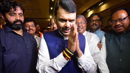 BJP leader Devendra Fadnavis along with other party leaders celebrates after CM Uddhav Thackeray resigns from his post, in Mumbai, India, on Wednesday. (Bhushan Koyande/HT Photo)
