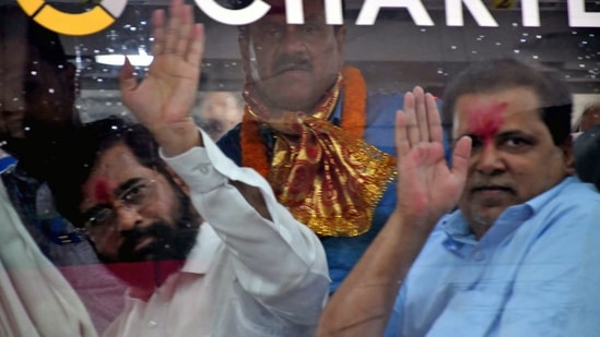 Rebel Shiv Sena leader Eknath Shinde with supporting MLAs visit Kamakhya Temple, in Guwahati. (ANI Photo)