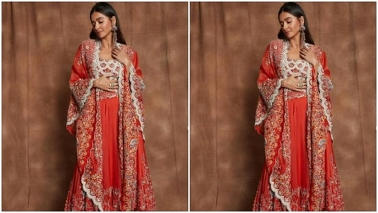 Shibani added more drama to her look with a dramatic red cape that featured detailing in multicoloured resham threads. It also came with white zari details at the borders.(Instagram/@shibanidandekarakhtar)