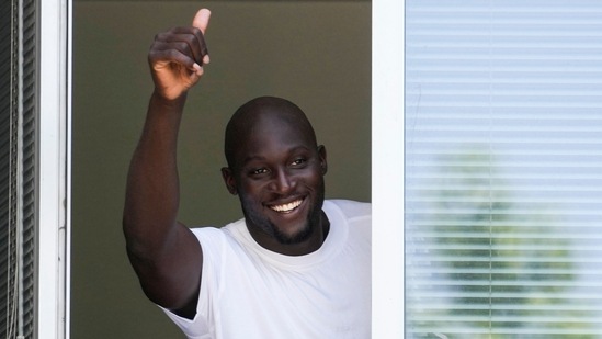 Romelu Lukaku gives his thumbs up as he salutes Inter Milan supporters from a window of the Italian Olympic Committee's headquarters in Milan, Italy,(AP) Romelu Lukaku gives his thumbs up as he salutes Inter Milan supporters from a window of the Italian Olympic Committee's headquarters in Milan, Italy,(AP)