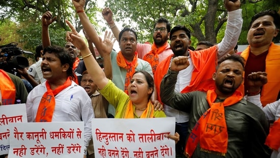 Activists of Bajrang Dal, a Hindu hardline group, shout slogans during a protest against the killing of a Hindu man in the city of Udaipur, a day after two Muslim men posted a video claiming responsibility for slaying him, in New Delhi, India, June 29, 2022. (REUTERS/Amit Dave)