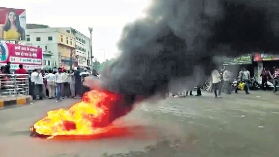 Locals protest after two men behead youth in Udaipur's Maldas on Tuesday. (ANI Photo)