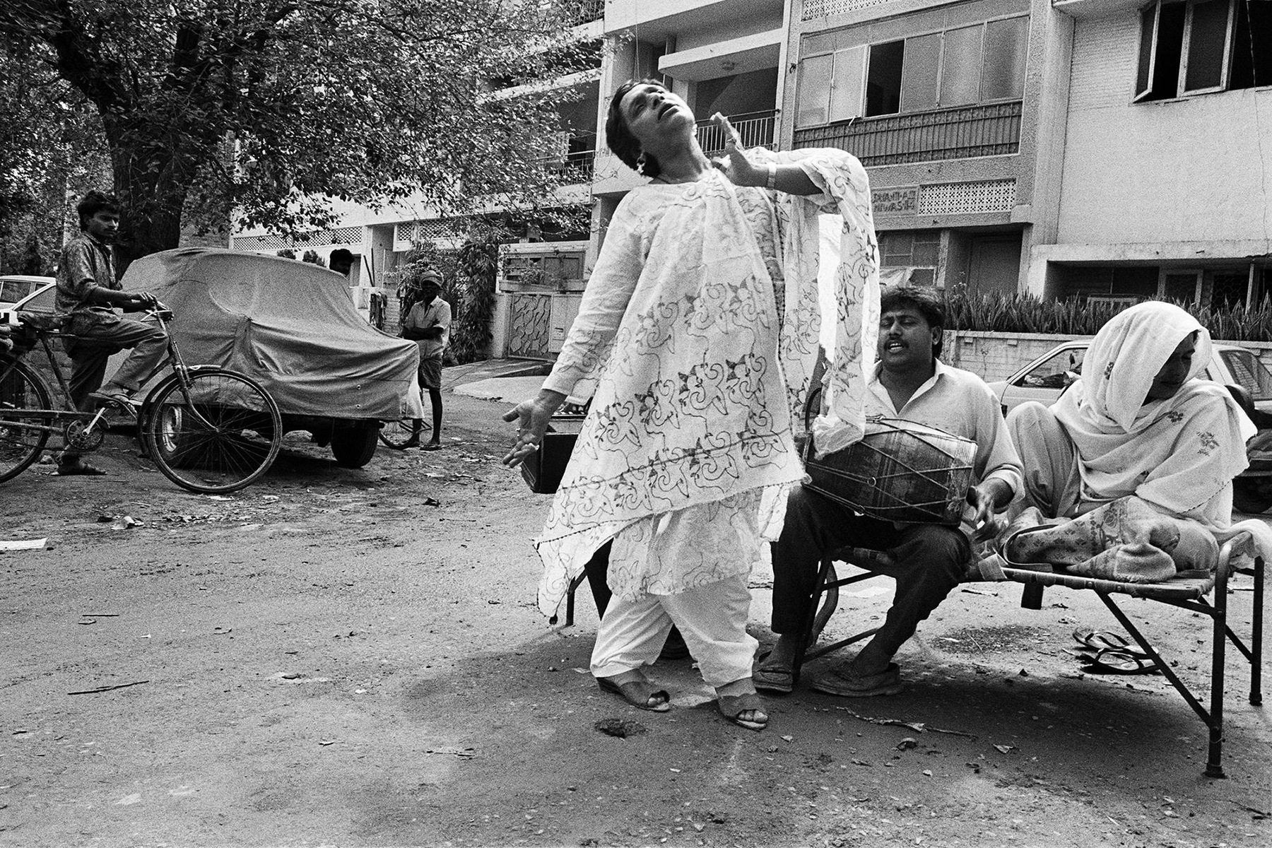 "To bless the newborn child, I am dancing in front of the house," Mona Ahmed, 1994. (From the book 'Myself Mona Ahmed' by Dayanita Singh) "To bless the newborn child, I am dancing in front of the house," Mona Ahmed, 1994. (From the book 'Myself Mona Ahmed' by Dayanita Singh)