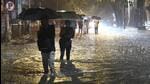 People wade through the waterlogged road near the Andheri subway on Thursday. Vijay Bate/HT Photo People wade through the waterlogged road near the Andheri subway on Thursday. Vijay Bate/HT Photo