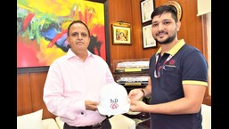 Kumar Keshav handing over his safety helmet to a maintainer.  (Sourced)