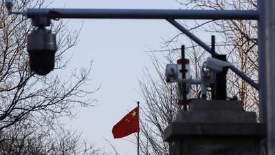 A Chinese flag is seen near surveillance cameras outside the Beijing No. 2 Intermediate People's Court in Beijing, China, on March 31, 2022. (REUTERS/FILE) A Chinese flag is seen near surveillance cameras outside the Beijing No. 2 Intermediate People's Court in Beijing, China, on March 31, 2022. (REUTERS/FILE)